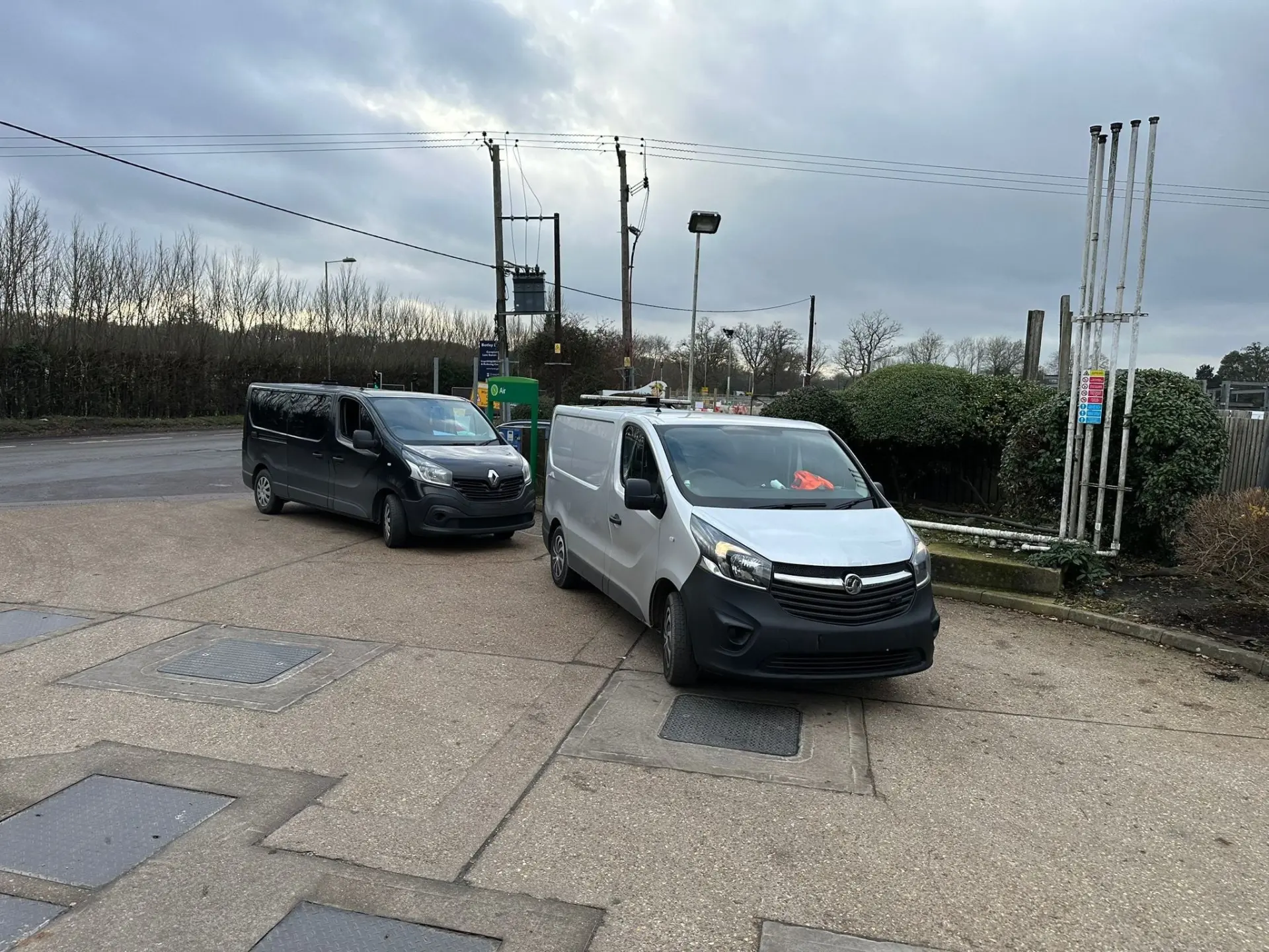 Petrol being drained out of Renault Trafic at petrol station