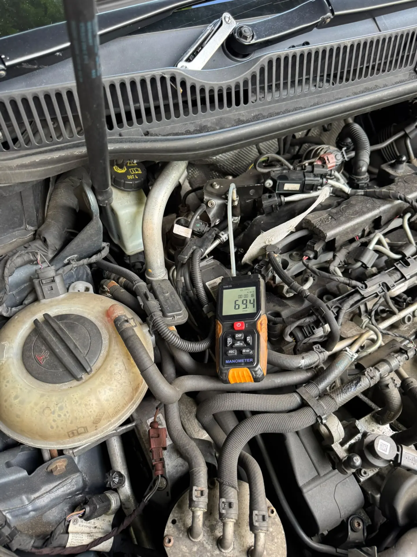 Heavy soot and carbon deposits expelled from a diesel vehicle's exhaust during an advanced DPF cleaning treatment.