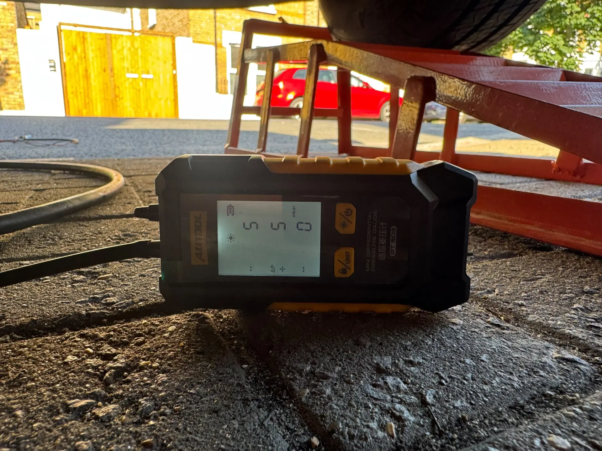 DPF pressure gauge displaying diesel particulate filter pressure readings during vehicle diagnostics.