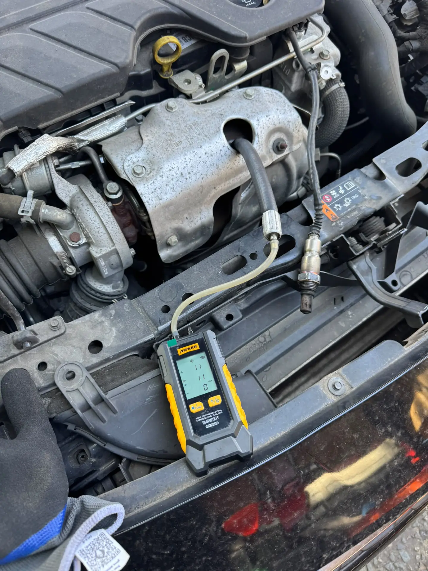 Vauxhall Astra DPF pressure test after professional DPF cleaning in West Ealing, London, showing differential pressure reduced from 117 mbar to 11 mbar.