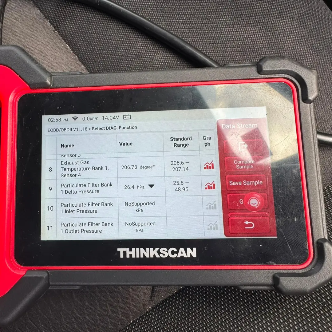 THINKSCAN diagnostic scanner showing Nissan Qashqai DPF delta pressure reading of 26.4 hPa before cleaning.