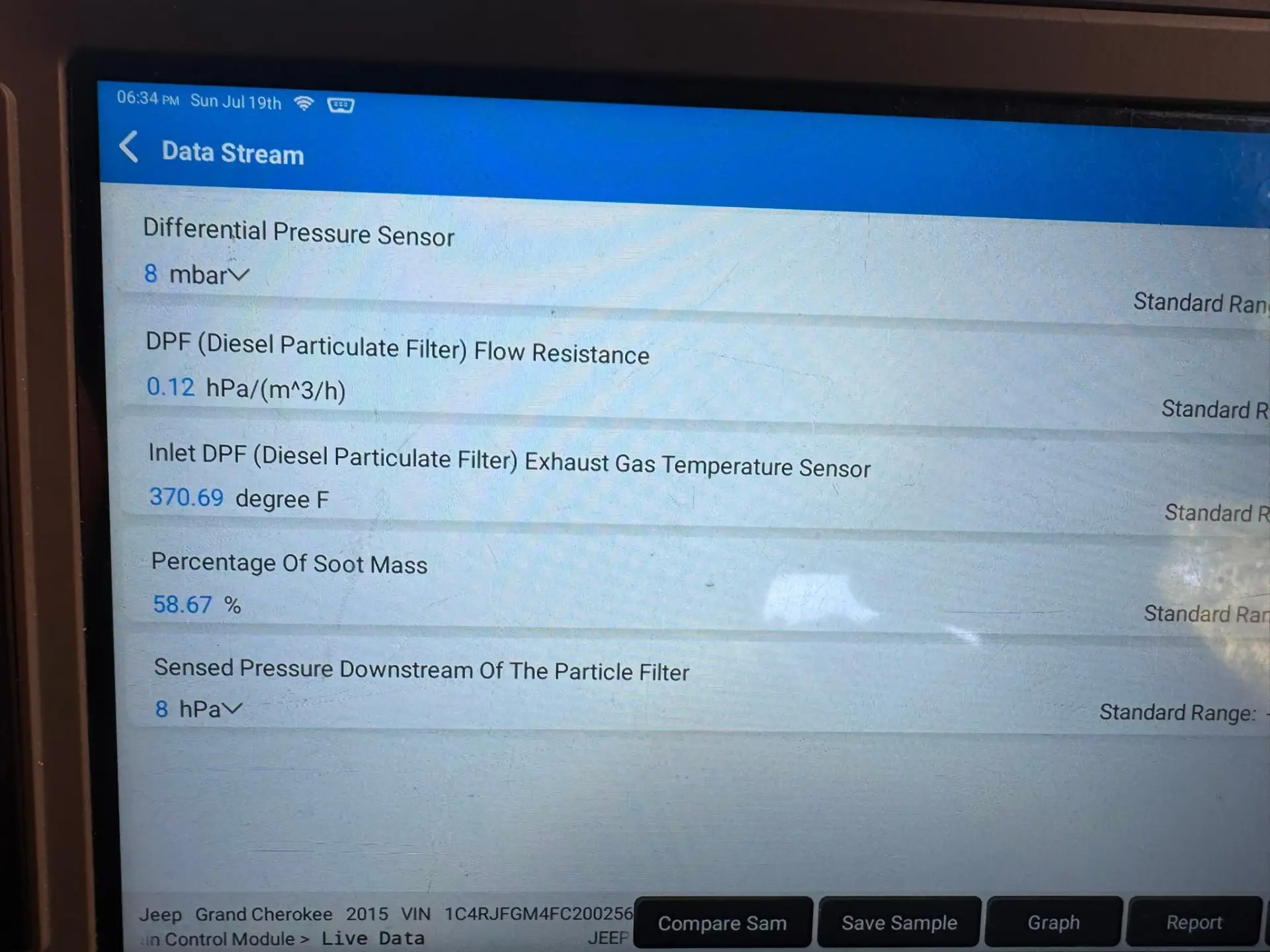 Jeep Grand Cherokee diagnostic scan showing DPF differential pressure reduced to 8 mbar after cleaning.